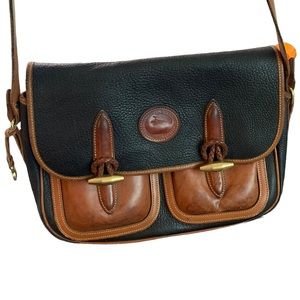 Dooney & Bourke vintage leather purse. Black and brown . All weather Leather